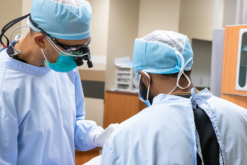 doctor performing guided dental surgery