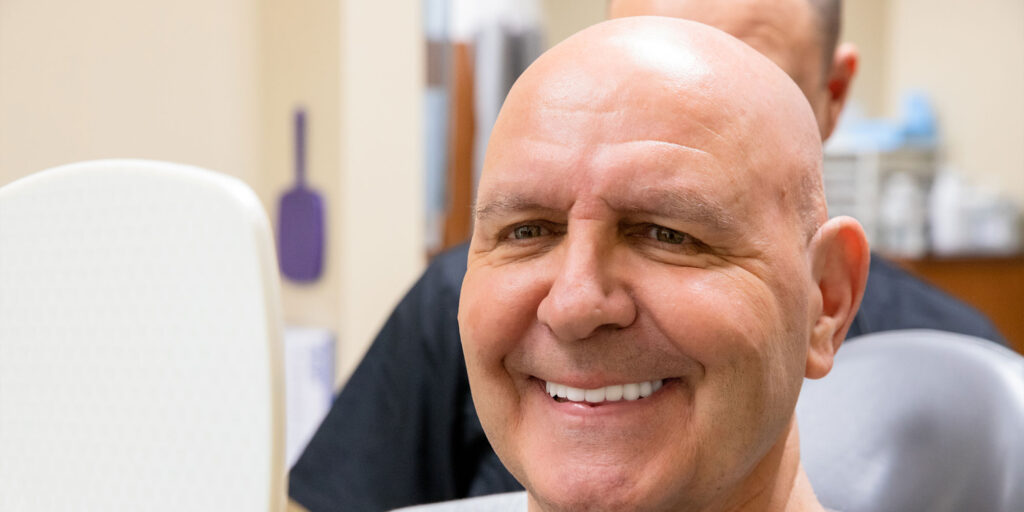 patient smiling confidently after their dental procedure